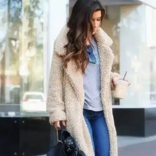 Beige faux fur coat with a cozy, plush texture and a classic collar.